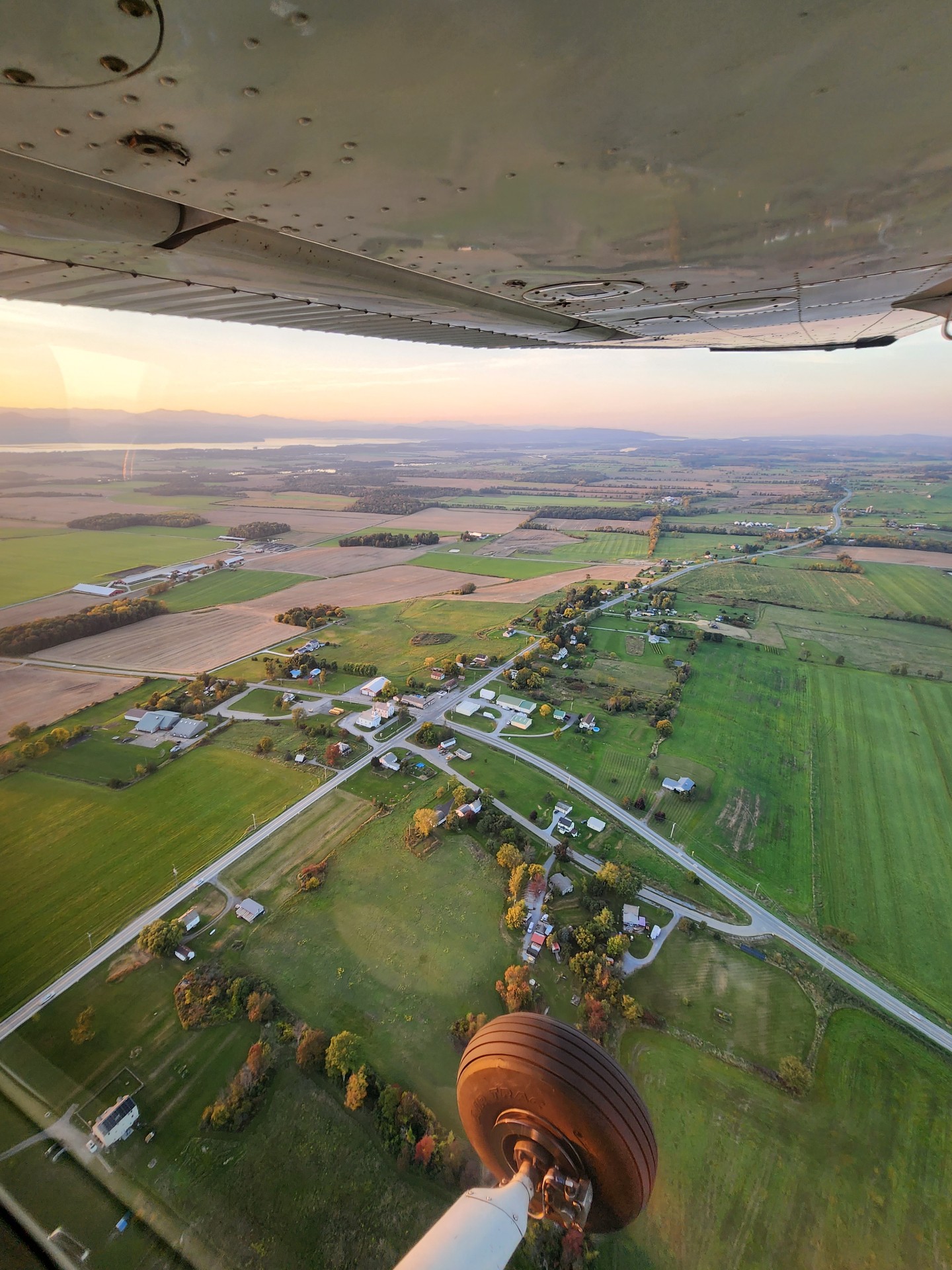 Aerial view over Vermont farmland at sunset